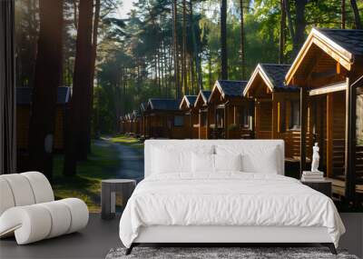 Serene forest resort with rows of identical holiday cabins, perfect for a peaceful getaway. Wall mural