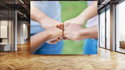 People, hands and fist bump in collaboration for community, partnership or trust together in the outdoors. Hand of team bumping fists in unity for agreement, coordination or support in solidarity Wall mural