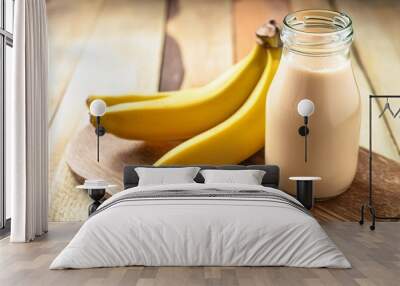 glass bottle of banana milk shake on wooden board fresh fruit tasty drink delicious beverage Wall mural