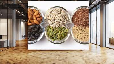 nutritious assorted seeds flat lay in small bowls on white surface Wall mural