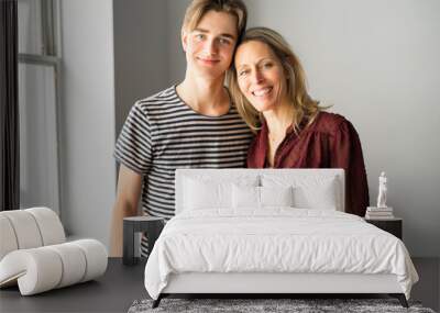 A people and family happy teen boy with mother at home Wall mural