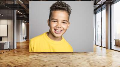 Adorable african boy on studio gray background Wall mural