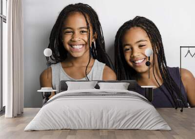 Adorable african twin little girls on studio gray background Wall mural