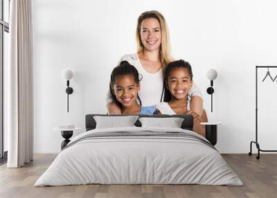 Afro twin child posing on a white background studio with white mother Wall mural