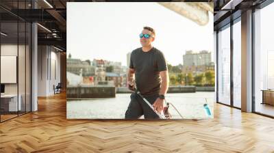 An Yacht athlete training for the competition on sea Wall mural