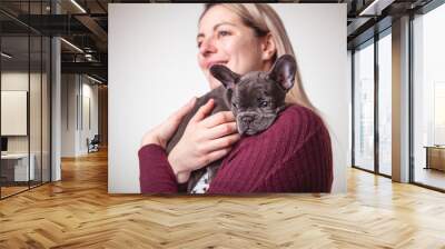 Beautiful woman with french bulldog on studio Wall mural