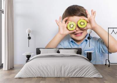 Boy having fun on studio grey background Wall mural