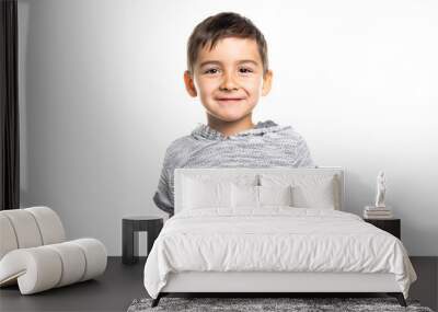 Boy having fun on studio white background Wall mural