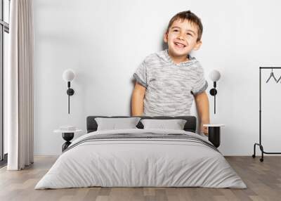 Boy having fun on studio white background Wall mural