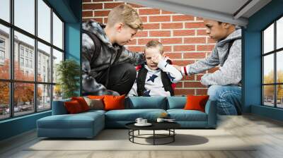 boy problem at school, sitting and consoling child each other Wall mural