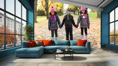 Childs on the leaf season. The autumn season Wall mural