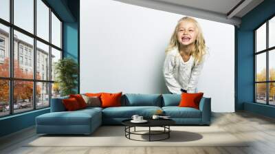 Cute girl 4-5 year old posing in studio Wall mural