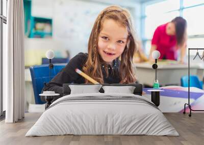 education and school concept little student girl studying at school Wall mural