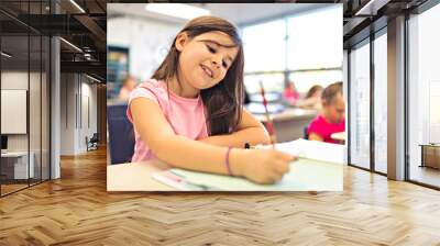 education and school concept little student girl studying at school Wall mural