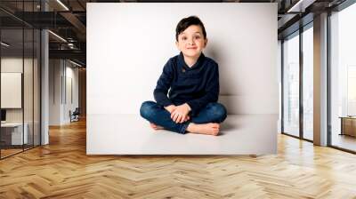 five years old boy sit on the floor Wall mural