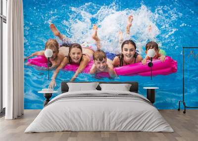 group of children having fun in Pool on the summer time Wall mural