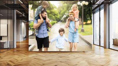 Happy familly in the park Wall mural