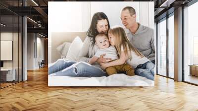 happy family on white bed in the bedroom Wall mural