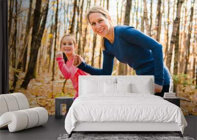 Healthy lifestyle mother and child running outdoor Wall mural