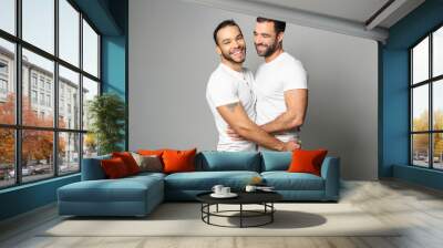 homosexual couple over a white background on studio Wall mural