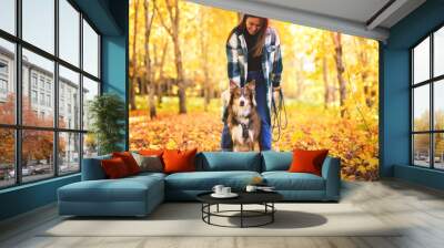 Loving woman with her shepherd Australian on fall season Wall mural