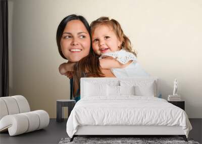 Mother with his daughter on studio white background Wall mural