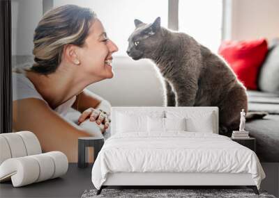 Nice Grey Cat with woman on sofa Wall mural