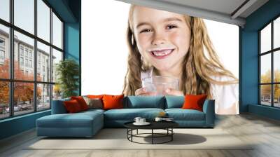 Portrait of a cute 7 years old girl Isolated over white background with milk glass Wall mural