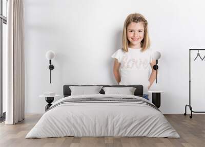 Portrait of a cute 7 years old girl Isolated over white background Wall mural