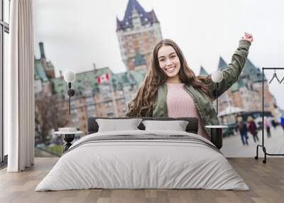 Quebec City scape with Chateau Frontenac and young teen enjoying the view. Wall mural