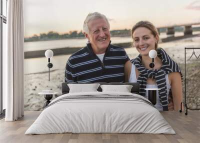 Senior father With Adult Daughter At Sea Wall mural