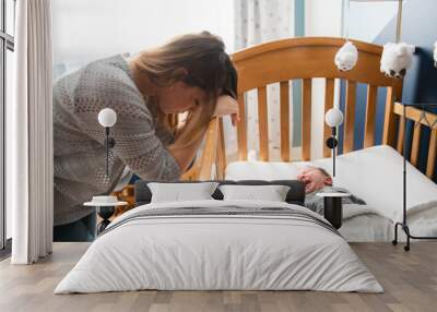 Tired Mother with Upset Baby Suffering with Post Natal Depression. Wall mural