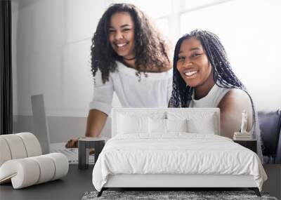 Two teen at desk in her office with laptop Wall mural