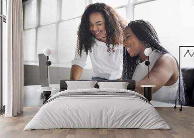 Two teen at desk in her office with laptop Wall mural