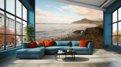 waves crashing on the rocky shore Wall mural