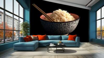 hot rice in a bowl and chopsticks black background Wall mural