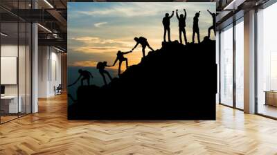 group of people on peak mountain climbing helping team work , travel trekking success business conce Wall mural