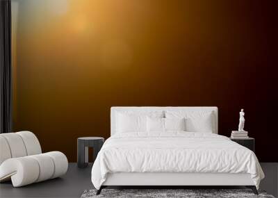 Lens flare and light beam on dark background yellow color, photo from lens camera Wall mural