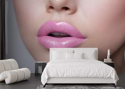 Close-up beautiful attractive woman with sweet pale soft pink lipstick  lips, sensual girl wearing stunning color makeup, flirty radiant female confident look beautiful womanly and feminine cosmetics Wall mural