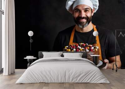 Male baker chef and his lovely beautiful decorated cake, skilled craft cake maker who love making cakes, cake business owner, bakery shop owner Wall mural