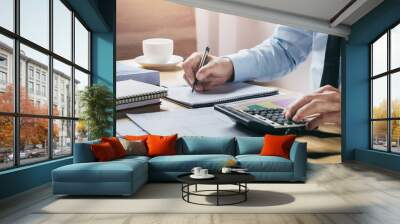 businessman working accountand finance with using calculator and pen on table in office Wall mural