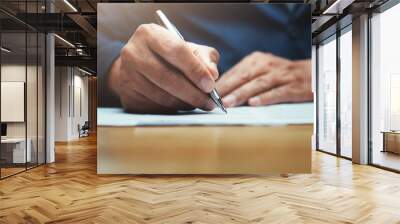 businessman writing on paper report in office Wall mural