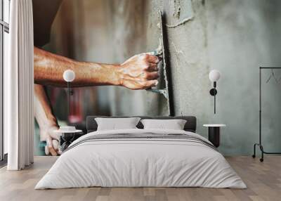 closeup hand of worker plastering cement at wall for building house Wall mural