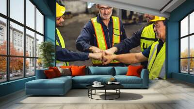 group of men in safety gear are shaking hands Wall mural