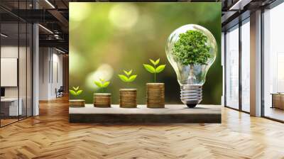 tree growing on coins and light bulb. concept saving money with energy Wall mural