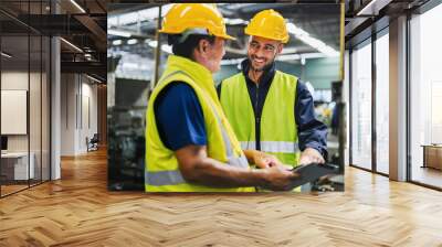 Two men in safety gear are talking to each other Wall mural