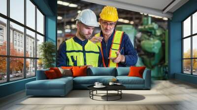 worker and engineer using tablet computer for inspection and checking production process on factory station Wall mural