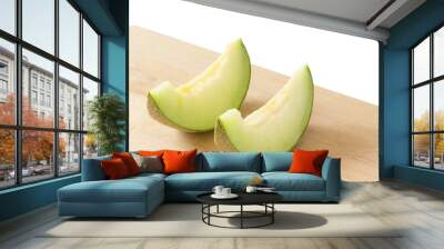 2 slices japanese melons on a wooden cutting board Wall mural