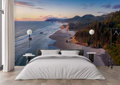 Aerial View of Arch Cape, Oregon. Sunset along the Oregon coast near Cannon Beach features white sand beaches with fir and cedar forests as far as the eye can see.  Wall mural