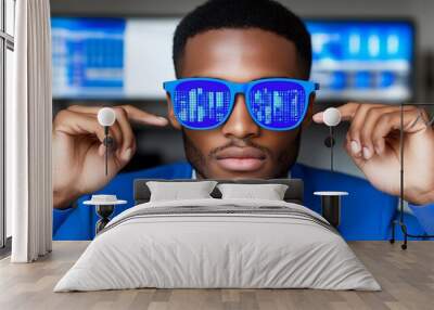 A businessman wearing blue sunglasses with a digital pattern looks at the camera. Wall mural